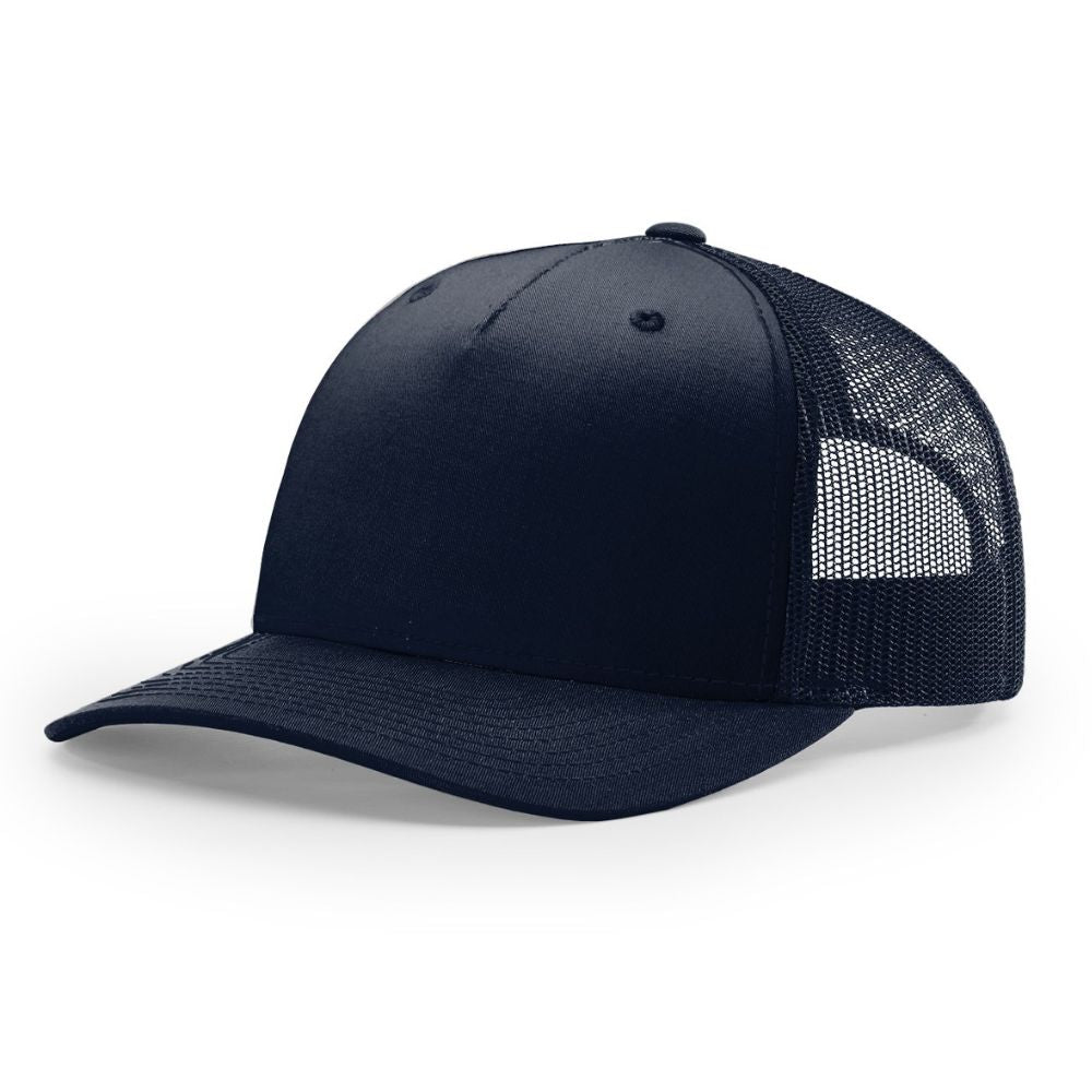 Angled view of a solid navy Richardson 112FP trucker hat featuring a structured front panel, curved brim, and matching navy mesh back, displayed on a white background.